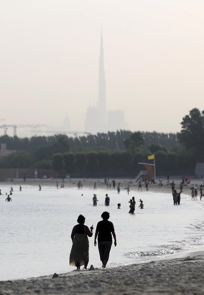 Dubai, United Arab Emirates - Reporter: N/A. News. Weather. Two ladies walk on the beach in Dubai as the sunrises. Tuesday, June 16th, 2020. Dubai. Chris Whiteoak / The National