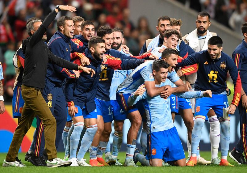 Spain's forward Alvaro Morata (C,R) celebrates with teammates after his team victory in the UEFA Nations League, league A, group 2 football match between Portugal and Spain, at the Municipal Stadium in Braga on September 27, 2022.  - Spain won 0-1.  (Photo by MIGUEL RIOPA  /  AFP)