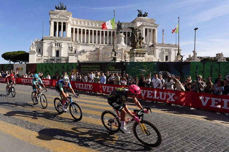 Cyclists ride through Rome. AP