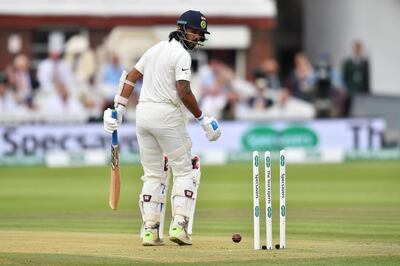 India's Murali Vijay looks back at the stumps after being bowled out by England's James Anderson for 0 runs on the second day of the second Test cricket match between England and India at Lord's Cricket Ground in London on August 10, 2018. (Photo by Glyn KIRK / AFP) / RESTRICTED TO EDITORIAL USE. NO ASSOCIATION WITH DIRECT COMPETITOR OF SPONSOR, PARTNER, OR SUPPLIER OF THE ECB
