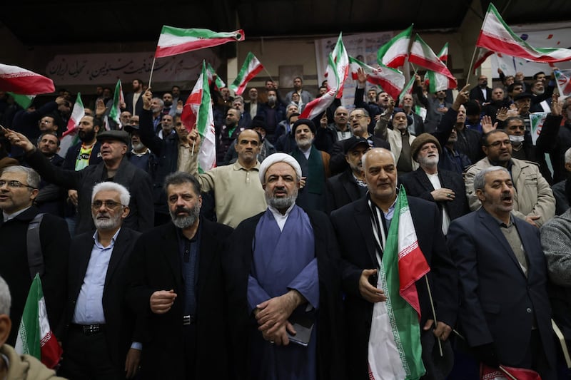 Hamid Rasaee (C), an Iranian Shiite Muslim cleric and former member of the Islamic Consultative Assembly, attends an electoral campaign rally at a sports stadium ahead of the upcoming elections, in Tehran on February 28, 2024.  Iran's supreme leader urged voters to come out in droves on March 1 and show the foes of the Islamic republic a "strong and fervent" election process for parliament and the key Assembly of Experts.  (Photo by ATTA KENARE  /  AFP)