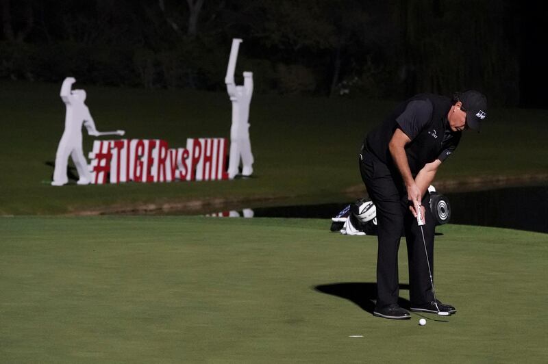 Nov 23, 2018; Las Vegas, NV, USA; Phil Mickelson putts to win on the 18th hole during The Match: Tiger vs Phil golf match at Shadow Creek Golf Course. Mandatory Credit: Rob Schumacher-USA TODAY Sports
