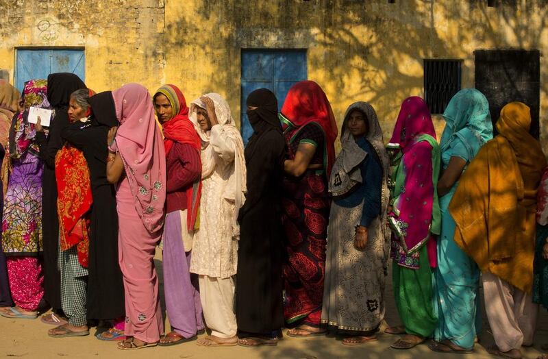 Indian women queueing to cast their votes at a village near Amroha in Uttar Pradesh, India, on Wednesday, Feb. 15, 2017. Uttar Pradesh and four other Indian states are having state legislature elections in February-March, a key mid-term test for Prime Minister Narendra Modi's Hindu nationalist government which has been ruling India since 2014. Manish Swarup / AP 
