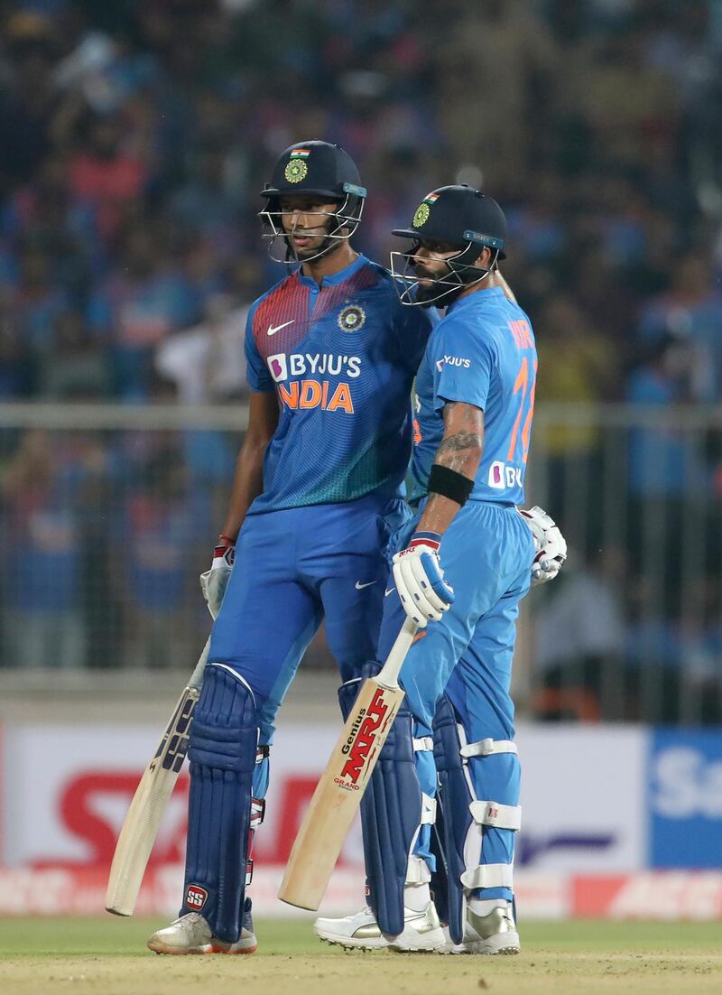 India's Shivam Dube, left, celebrates with captain Virat Kohli. he was soon out for 54. AP