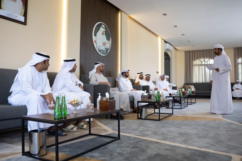 Sheikh Mohamed bin Zayed, Crown Prince of Abu Dhabi and Deputy Supreme Commander of the Armed Forces (3rd L) listens to a poem during a visit to the home of Dr Omar Habtoor Al Derei, Director General of the UAE Fatwa Council (4th L). Seen with Hamad Habtoor Al Derei (2nd L) and Sheikh Mohammed bin Hamad bin Tahnoon, adviser for Special Affairs at the Ministry of Presidential Affairs (5th L) and other dignitaries.