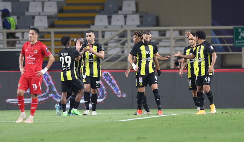 Abderrazak Hamdallah, third from left, of Al Ittihad celebrates after scoring their second goal against Al Wehda. EPA 