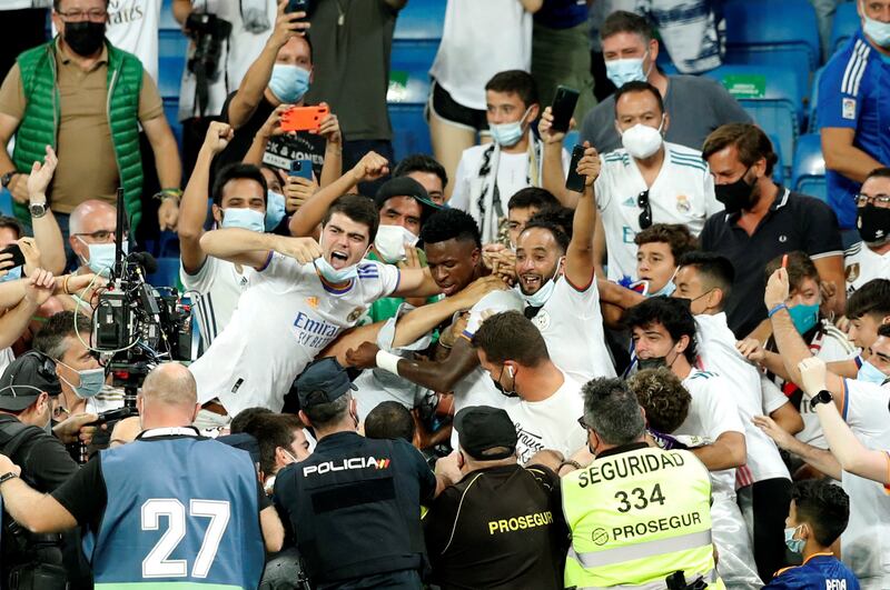 Real Madrid striker Vinicius Junior celebrates with the fans after scoring to make the score 3-2 against Celta Vigo. EPA