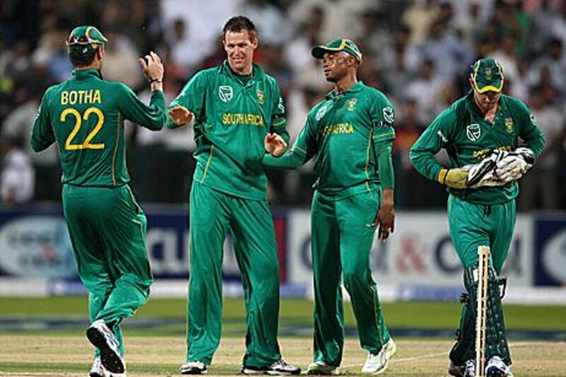 Rusty Theron, second left, claimed four wickets for South Africa in their second six-wicket T20 triumph over Pakistan.