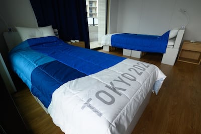 (FILES) This file photo taken on June 20, 2021 shows recyclable cardboard beds and mattresses for athletes during a media tour at the Olympic and Paralympic Village for the Tokyo 2020 Games in Tokyo.  - For athletes competing at the Tokyo Games, the Olympic Village will be almost all they see, with strict coronavirus rules preventing them from leaving the compound except to train and compete.  (Photo by Akio KON  /  POOL  /  AFP)  /  TO GO WITH Oly-2020-2021-Japan-health-virus-Village,FOCUS by Etienne Balmer