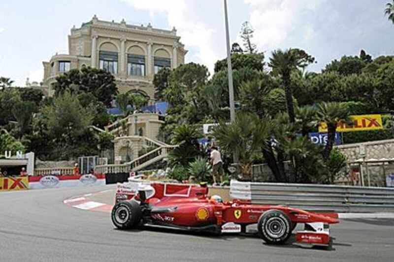 Fernando Alonso manouvres his car around the Casino section of the Monaco circuit.