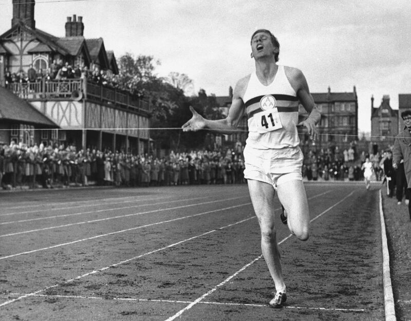 FILE - In this May 6, 1954, file photo, British athlete Roger Bannister breaks the tape to become the first man ever to break the four minute barrier in the mile at Iffly Field in Oxford, England. Bannister, the first runner to break the 4-minute barrier in the mile, has died. He was 88. Bannisterâ€™s family said in a statement that he died peacefully on Saturday, March 3, 2018, in Oxford â€œsurrounded by his family who were as loved by him, as he was loved by them.â€  (AP Photo/File)