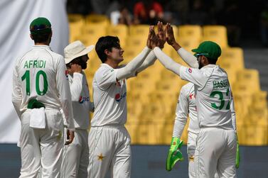Pakistan's Naseem Shah (C) celebrates with teammates after bowling out Australia's Nathan Lyon (not pictured) during the second day of the third cricket Test match between Pakistan and Australia at the Gaddafi Cricket Stadium in Lahore on March 22, 2022.  (Photo by Aamir QURESHI  /  AFP)