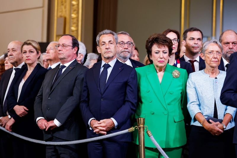 From left: France's European and Foreign Affairs Minister Jean-Yves Le Drian, France's Ecological Transition Minister Barbara Pompili, French former president Francois Hollande, French former president Nicolas Sarkozy, France's Culture Minister Roselyne Bachelot, France's Health Minister Olivier Veran, France's Labour Minister Elisabeth Borne and French Justice Minister Eric Dupond-Moretti attend Emmanuel Macron's speech at the Elysee presidential palace in Paris. AFP