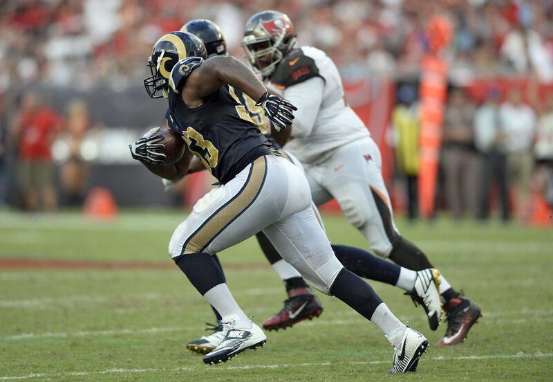 Los Angeles Rams defensive tackle Ethan Westbrooks runs 77 yards with a fumble recovery for a touchdown against the Tampa Bay Buccaneers. Jason Behnken / AP Photo 