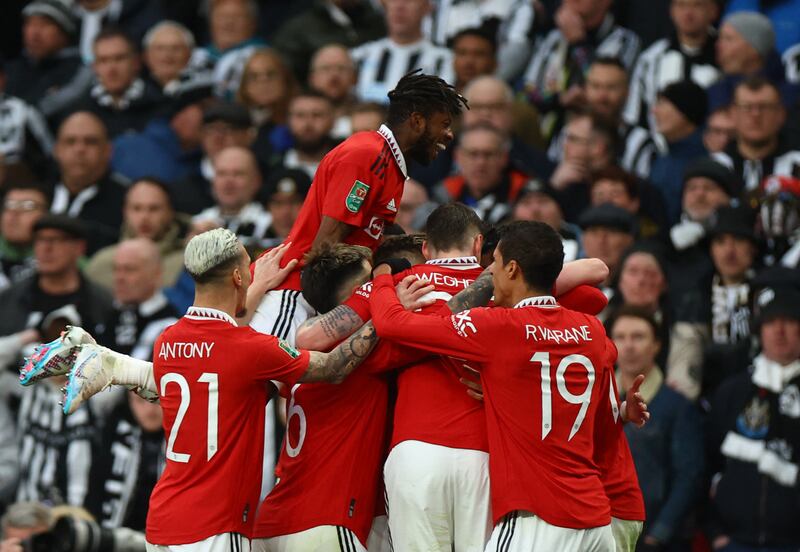 Manchester United players celebrate Casemiro's opening goal. Reuters
