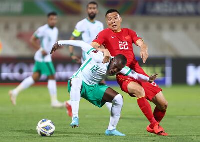 Yu Dabao of China competes for the ball with Saud Abdullah Abdulhamid of Saudi Arabia during their Fifa World Cup Asian Qualifying match at the Sharjah Football Stadium in March. Getty