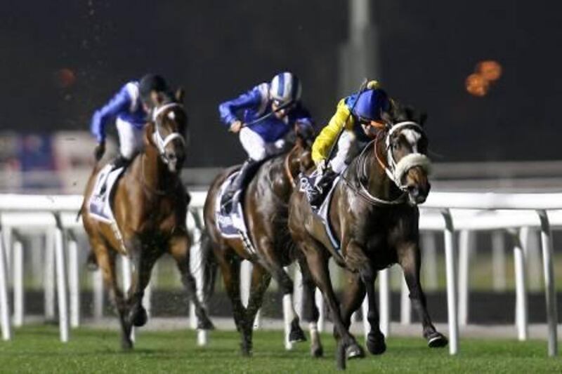 Dubai, United Arab Emirates, Jan 5 2012, Meydan , Dubai World Cup Carnival, Al Rashidiya Trial,  Race 6-(right Blue Cap)  #10`MAHBOOBA ridden by Christopher Soumillon  and trained by Mike de Kock charges to the wire to win race six. Mike Young / The National?