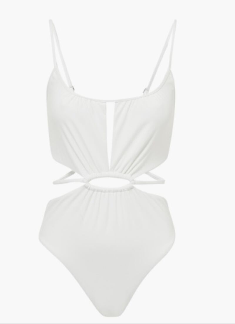 Cut-out swimsuits: the white Jonathan Simkhai Genesis cut-out swimsuit brings a plethora of details to this classic one-piece, with spaghetti straps, ruching, cut-outs and a midsection belt, all combining to make it a key piece for summer; Dh606,  Jonathan Simkhai at bloomingdales.ae. Photo: Bloomingdales
