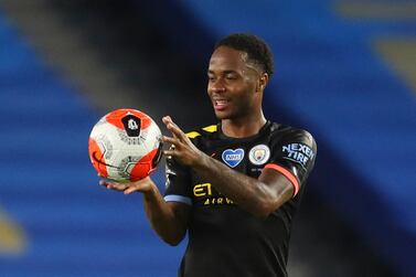 Manchester City's Raheem Sterling holds the ball after scoring a hattrick at Brighton. AP