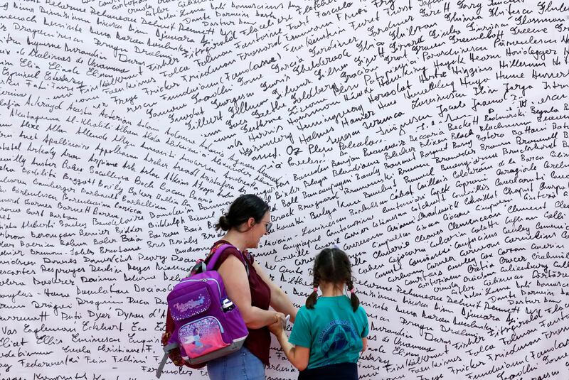 A mother and her daughter attend the Bookfest International book fair at Romexpo trade complex in Bucharest, Romania. EPA