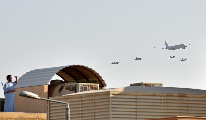 Civil and military aircraft fly over Riyadh marking Saudi Arabia's 90th National Day. AFP