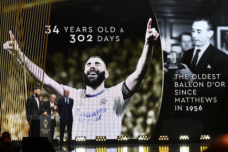 Karim Benzema receives the Ballon d'Or award from Zinedine Zidane next to his mother Malika Benzema, his son Ibrahim and his father Hafid Benzema. Getty Images
