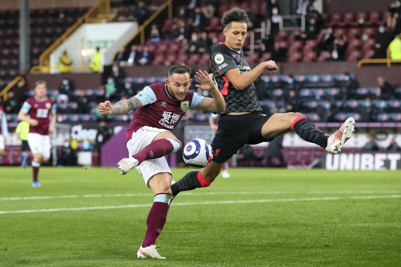 Burnley's English midfielder Josh Brownhill (L) vies with Liverpool's English defender Rhys Williams during the English Premier League football match between Burnley and Liverpool at Turf Moor in Burnley, north west England on May 19, 2021. (Photo by Alex Livesey / POOL / AFP) / RESTRICTED TO EDITORIAL USE. No use with unauthorized audio, video, data, fixture lists, club/league logos or 'live' services. Online in-match use limited to 120 images. An additional 40 images may be used in extra time. No video emulation. Social media in-match use limited to 120 images. An additional 40 images may be used in extra time. No use in betting publications, games or single club/league/player publications. / 