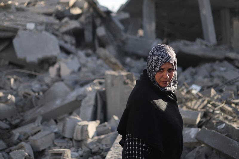 A Palestinian woman surveys the devastation after an Israeli air strike in Rafah. Reuters