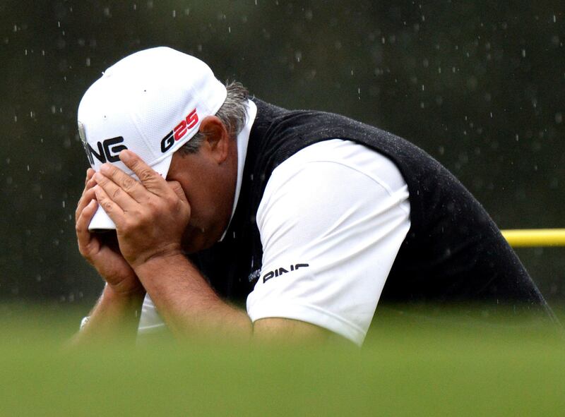 Angel Cabrera of Argentina reacts after missed a putt on the 17th hole  during the fourth round of the 77th Masters golf tournament at Augusta National Golf Club on April 14, 2013 in Augusta, Georgia.  AFP PHOTO /  DON EMMERT
 *** Local Caption ***  912336-01-08.jpg