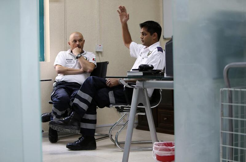 “When you get a call saying a patient is unconscious you expect the worst,” says Fahan Husain, right, area manager for Ajman and rural Sharjah. With him is Andy Gummer, area manager for the Sharjah response team.