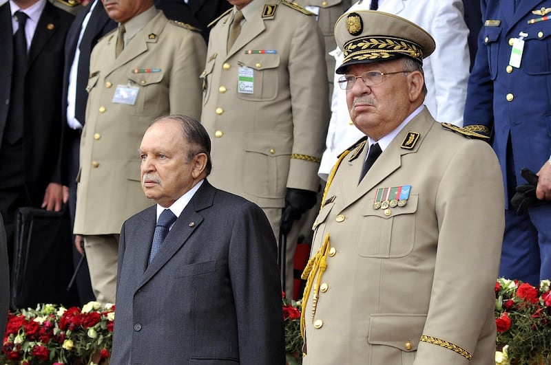 epa07465137 Algerian President Abdelaziz Bouteflika (L) and Deputy Minister for National Defense and Chief of Staff of the People's National Army (ANP), Ahmed Gaid Salah (R) attend an event in Algiers, Algeria, 27 June 2012 (issued 26 March 2019). Official Algerian media reports state Salah on 26 March called for the implementation of Article 102 of the Constitution to end the current political crisis in the county, which allows the Constitutional Council to declare the position of president vacant if the leader is unfit to rule. Protests continue in Algeria despite Algeria's president announcement on 11 March that he will not run for a fifth Presidential term and postponement of presidential elections previously scheduled for 18 April 2019 until further notice.  EPA/STRINGER