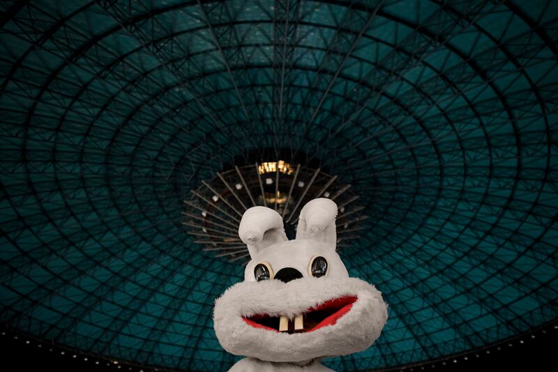 An entertainer wearing a rabbit costume amuses Ukrainian children on Maundy Thursday in a centre for refugees in Bucharest, Romania. AP Photo