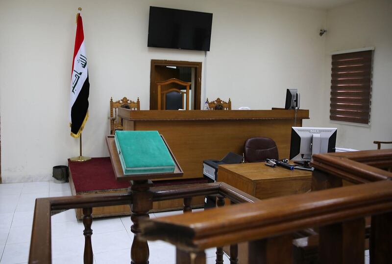 A picture shows a courtroom at Baghdad's Karkh main appeals court building in the western sector of the Iraqi capital on May 29, 2019 where French jihadists accused of belonging to the Islamic state are being tried. The Baghdad court sentenced a Frenchman to death for joining the Islamic State group, bringing to seven the number of French jihadists on death row in Iraq. / AFP / SABAH ARAR
