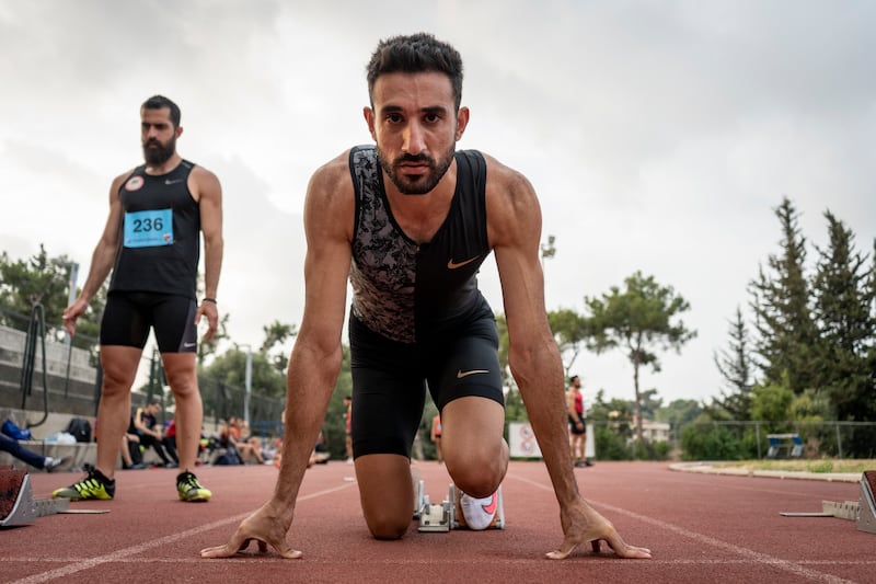 Lebanese sprinter Nour Hadid prepares in his newly donated running gear.