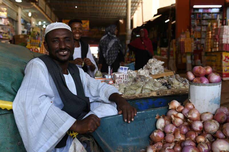 A Sudanese stallholder waits for a customer in a local market in Khartoum, Sudan. EPA 