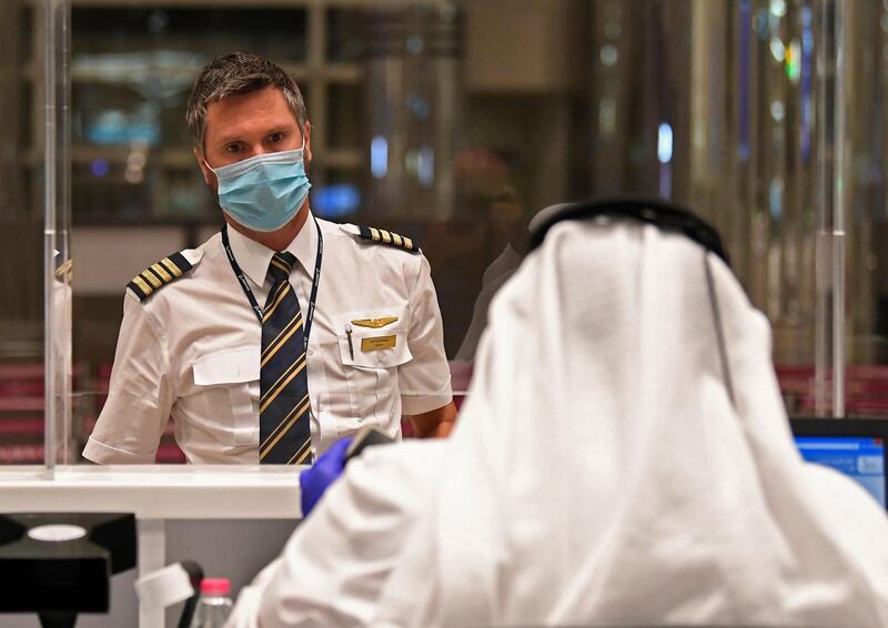 The captain of an Emirates flight from London arrives at Dubai International. AFP