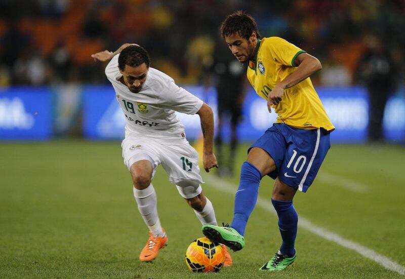 Brazil are expected to be led by Neymar, right, at the 2014 World Cup, which they will host. Marco Longari / AFP  