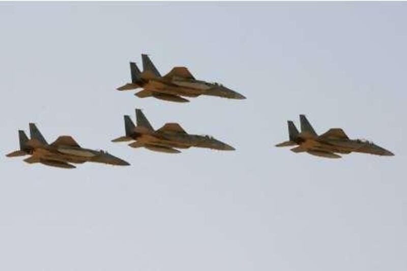 In this photo taken Sunday, Jan. 25, 2009, F-15 warplanes of the Saudi Air Force fly over the Saudi Arabian capital Riyadh during a graduation ceremony at King Faisal Air Force University. According to Arab diplomats speaking on condition of anonymity, Saudi Arabian Tornado and F-15 warplanes have bombarded targets inside Yemen since Wednesday afternoon, inflicting significant casualties on the Yemeni Shiite rebels. (AP Photo/Hassan Ammar)