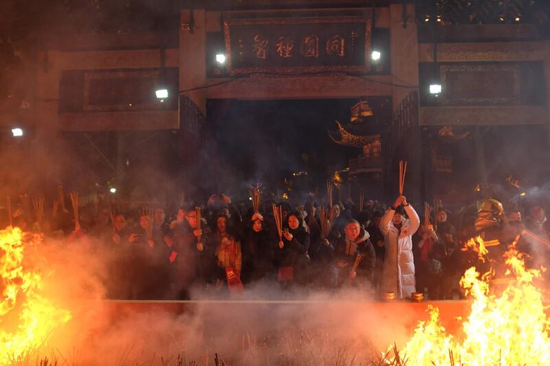 Crowds pray for good fortune at Longhua temple in Shanghai. AFP