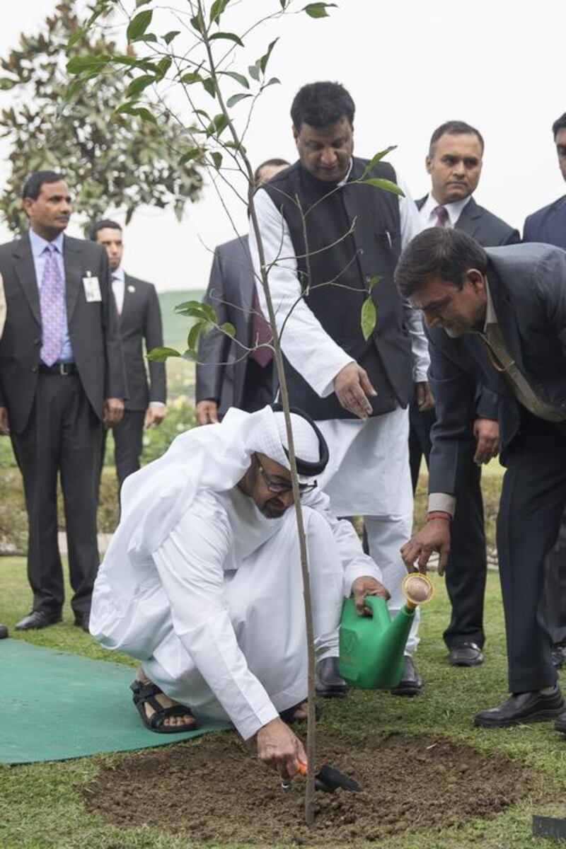 Sheikh Mohammed bin Zayed, Crown Prince of Abu Dhabi and Deputy Supreme Commander of the Armed Forces plants a tree at the Raj Ghat, during an official visit to India. Mohamed Al Hammadi / Crown Prince Court — Abu Dhabi