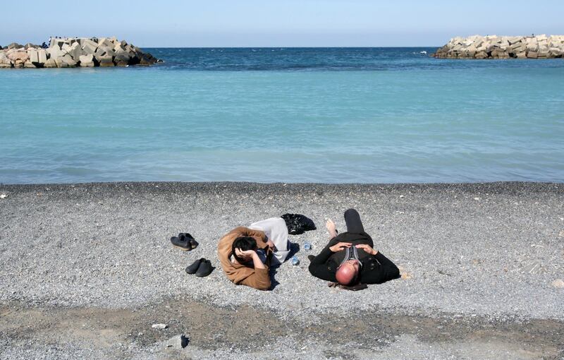 People lay at a beach in Algiers, Algeria. Reuters