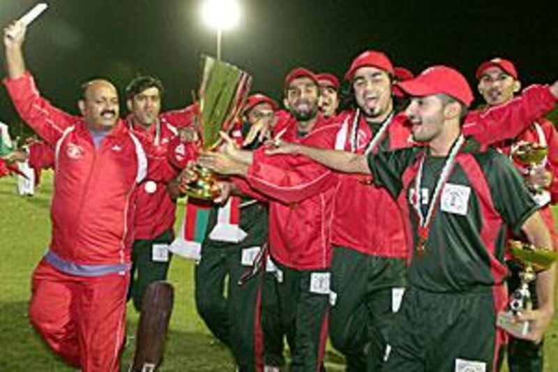 Oman cricketers celebrate their victory over the UAE in the final of  the first Gulf Cup.
