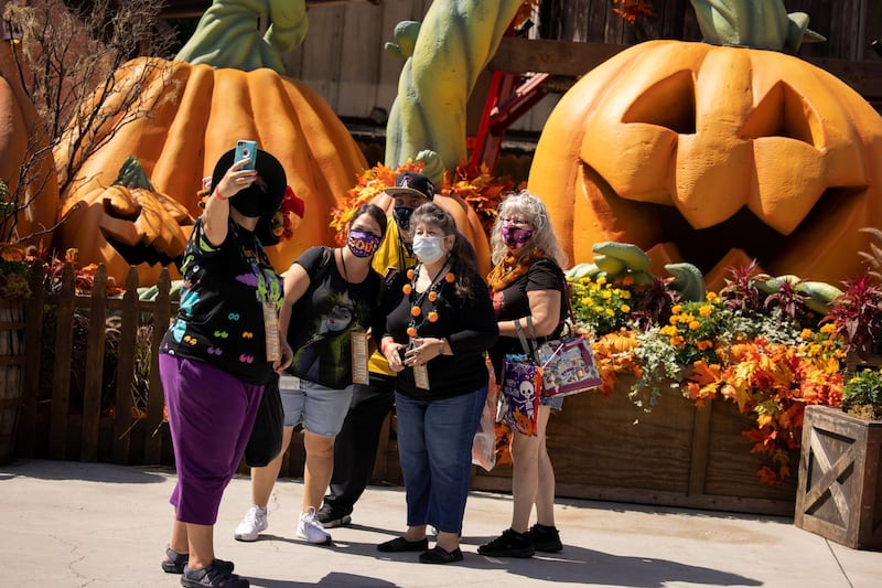 People wear face masks as Knott's Berry Farm opens a Halloween-themed attraction in Buena Park, California, US. Reuters