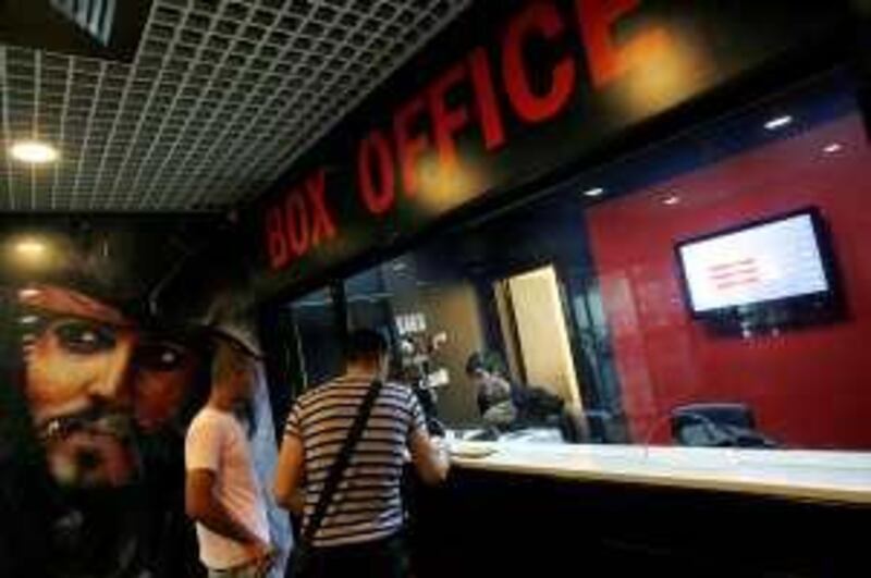 NABLUS, WEST BANK - JUNE 30: Palestinian teens make enquires at the ticket booth at Cinema City on Tuesday, June 30, 2009, in Nablus, West Bank.  *** Local Caption ***  20090630wp_012.jpg