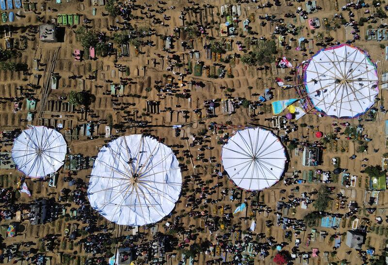 Residents participate in the making of giant kites during the celebration of All Saints Day in Santiago Sacatepequez, Guatemala. Reuters