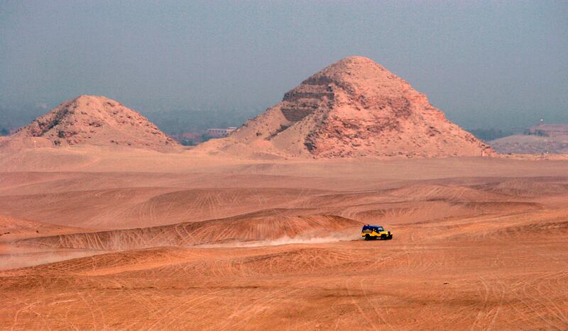 An off-road vehicle passes near the 5th Dynasty Abusir Pyramids (2464-2323BC) of Dahshur, 30 kilometres south of Cairo.  EPA