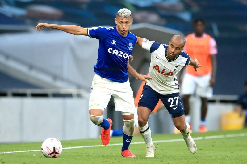 Everton's Richarlison, left, under pressure from Lucas Moura of Spurs. PA