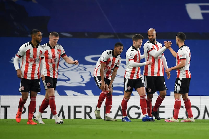 LONDON, ENGLAND - NOVEMBER 07: David McGoldrick of Sheffield United celebrates with teammates after scoring his team's first goal during the Premier League match between Chelsea and Sheffield United at Stamford Bridge on November 07, 2020 in London, England. Sporting stadiums around the UK remain under strict restrictions due to the Coronavirus Pandemic as Government social distancing laws prohibit fans inside venues resulting in games being played behind closed doors. (Photo by Mike Hewitt/Getty Images)