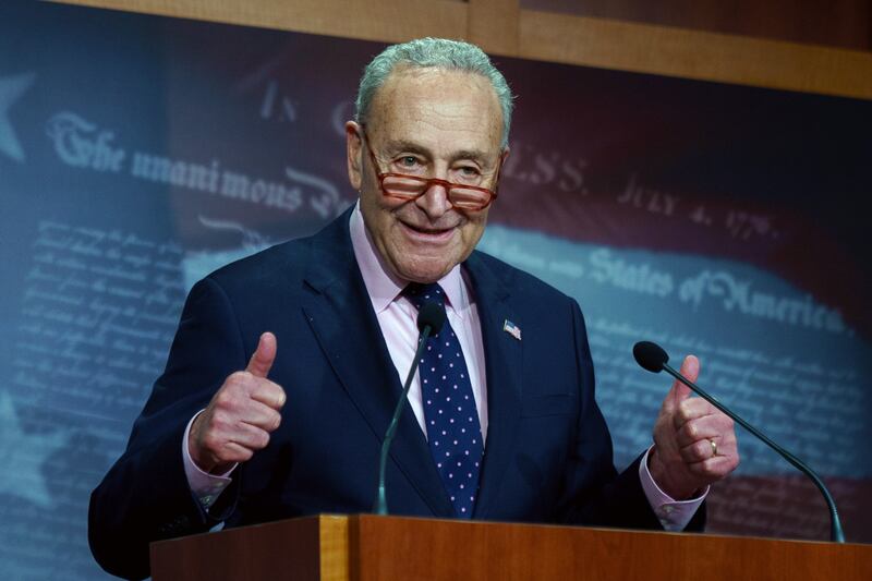 Senate Majority Leader Chuck Schumer celebrates after the Senate signed a stopgap bill to avoid a government shutdown. EPA
