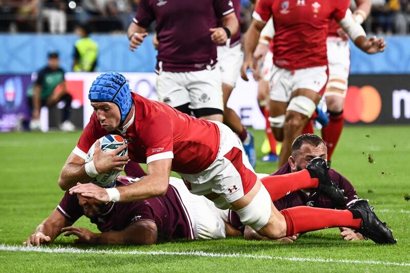 Wales' flanker Justin Tipuric scores a try. AFP